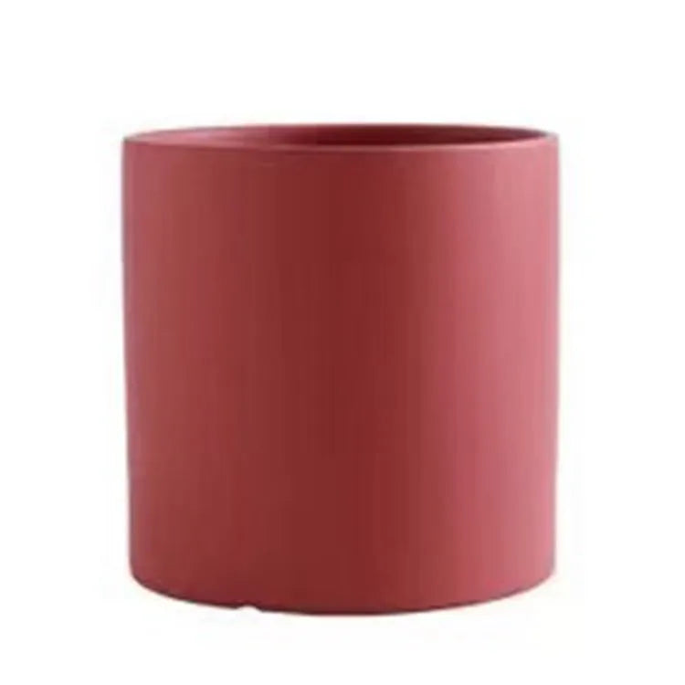 Cylindrical ceramic succulent planter with drainage hole in Nordic style, shown in a selected colour.