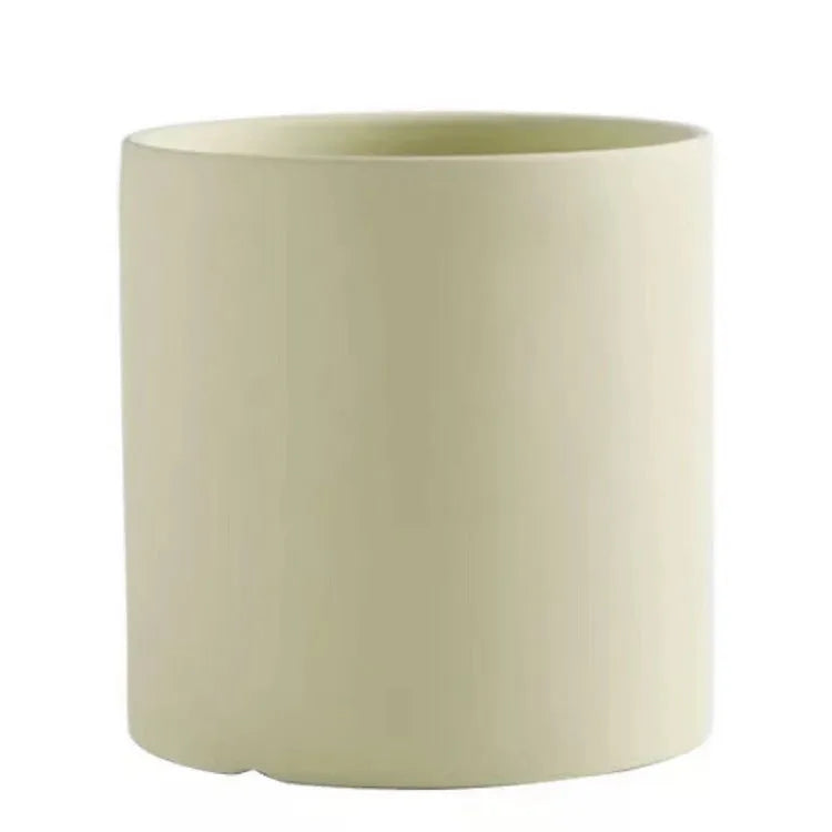 Cylindrical ceramic succulent planter with drainage hole in Nordic style, shown in a selected colour.