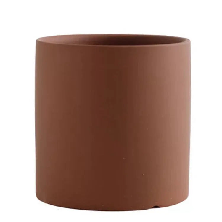 Cylindrical ceramic succulent planter with drainage hole in Nordic style, shown in a selected colour.