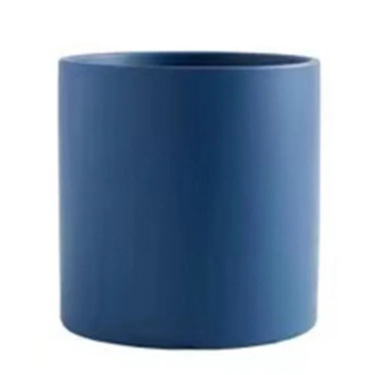 Cylindrical ceramic succulent planter with drainage hole in Nordic style, shown in a selected colour.
