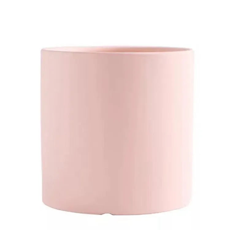 Cylindrical ceramic succulent planter with drainage hole in Nordic style, shown in a selected colour.