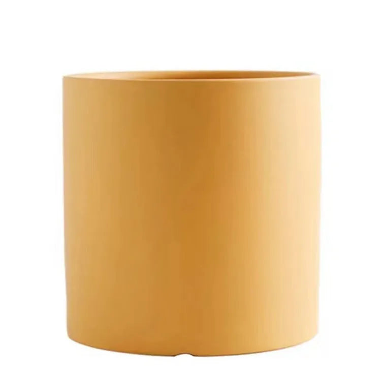 Cylindrical ceramic succulent planter with drainage hole in Nordic style, shown in a selected colour.