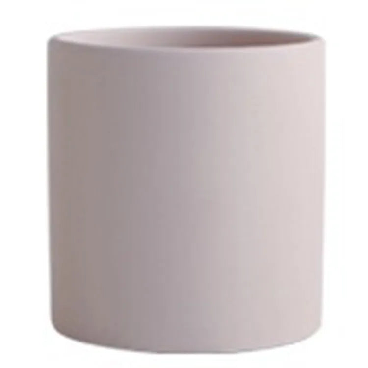 Cylindrical ceramic succulent planter with drainage hole in Nordic style, shown in a selected colour.