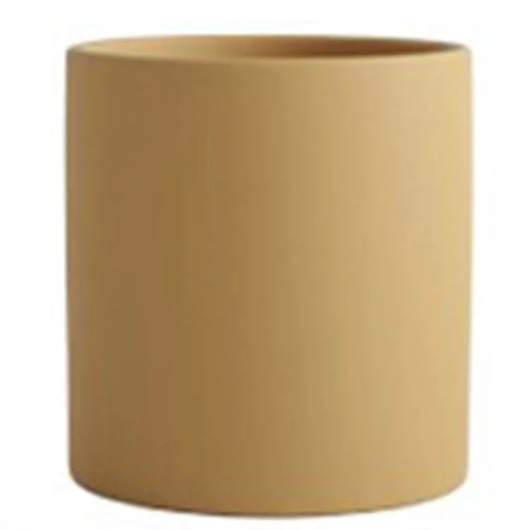 Cylindrical ceramic succulent planter with drainage hole in Nordic style, shown in a selected colour.