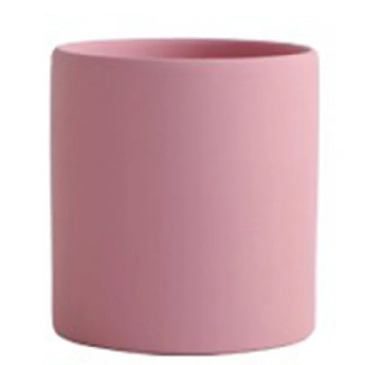 Cylindrical ceramic succulent planter with drainage hole in Nordic style, shown in a selected colour.