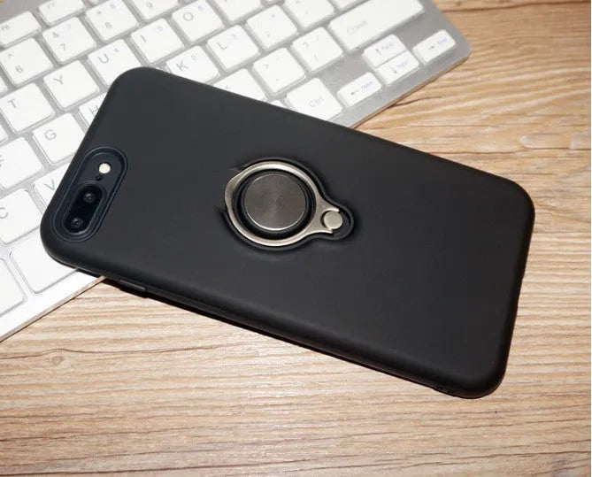 Slim black magnetic back cover case for iPhone on a magnetic car vent mount.