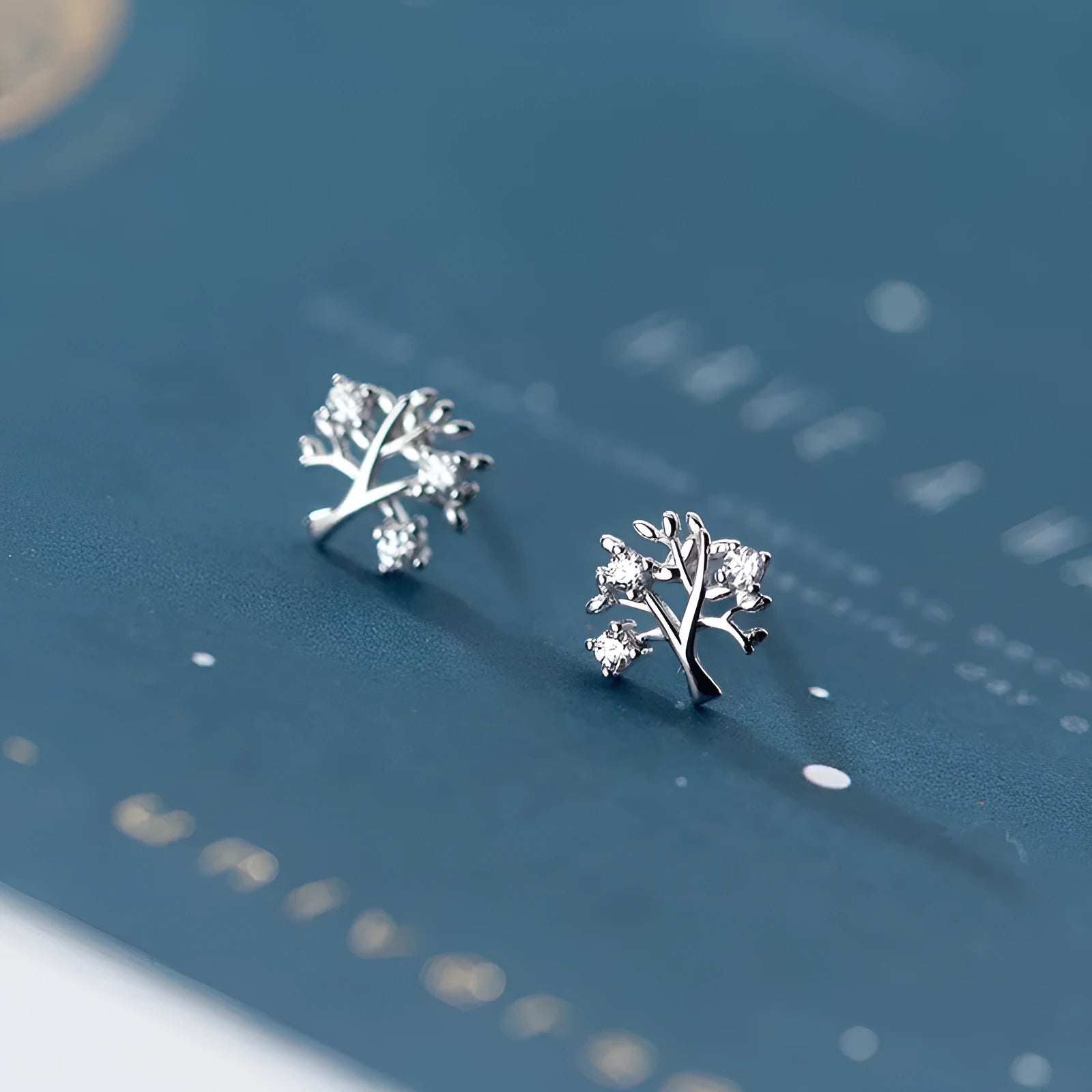 White gold coloured copper stud earrings with cute little tree design electroplated finish for women