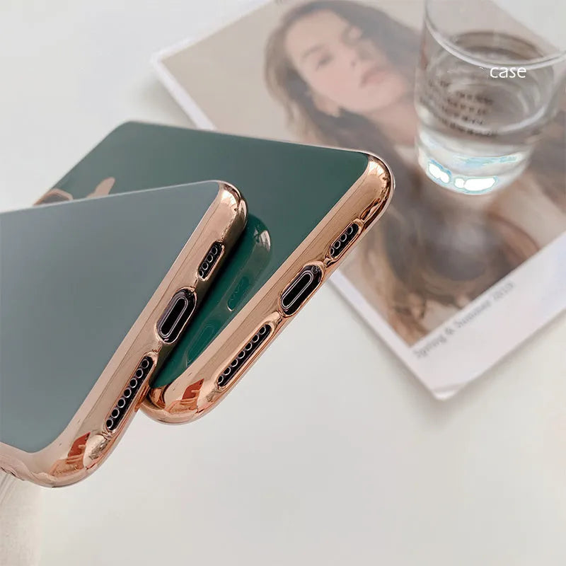 Simple solid-colour TPU back cover case for iPhone on a table, showing blue colour option.