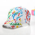 Children's cotton baseball cap with graffiti design, shown in black, pink, red and white colour options.