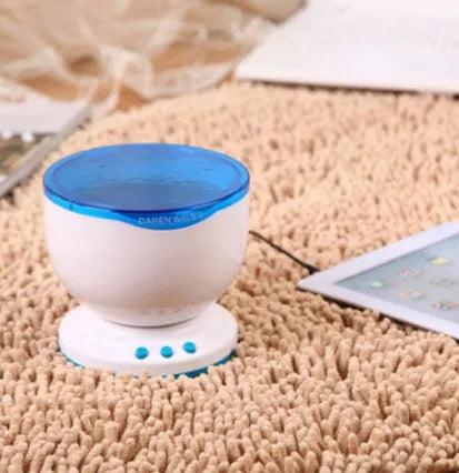 Blue fixed-mount ocean projection lamp for children's puzzle activities.