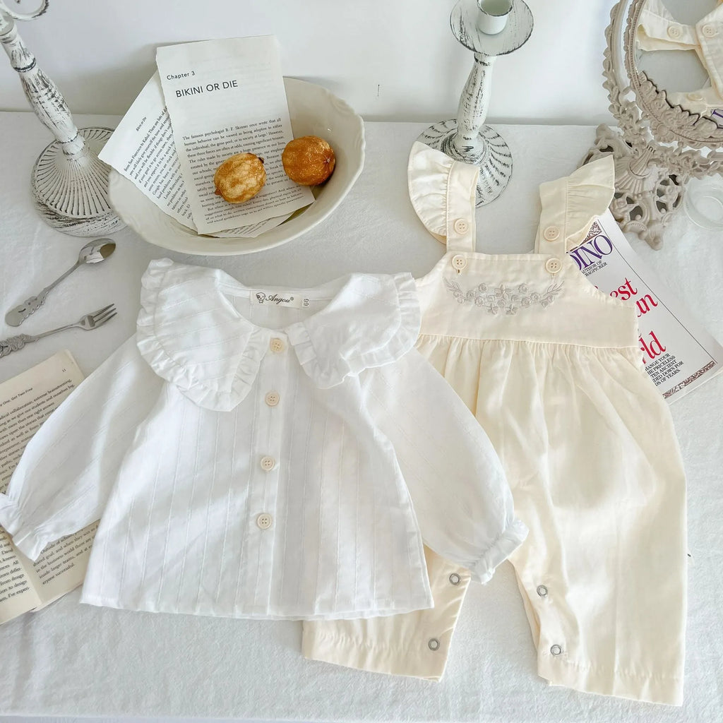 Apricot coloured baby girl's cotton romper with white top, adjustable suspenders, and mid-waist trousers.