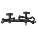 Black plastic umbrella clip attached to camera tripod holding smartphone under umbrella