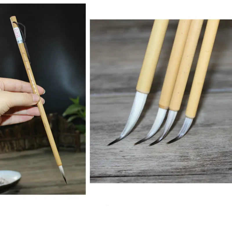 Four Chinese calligraphy brushes with thin gold bodies and natural hair bristles in pine branch colours