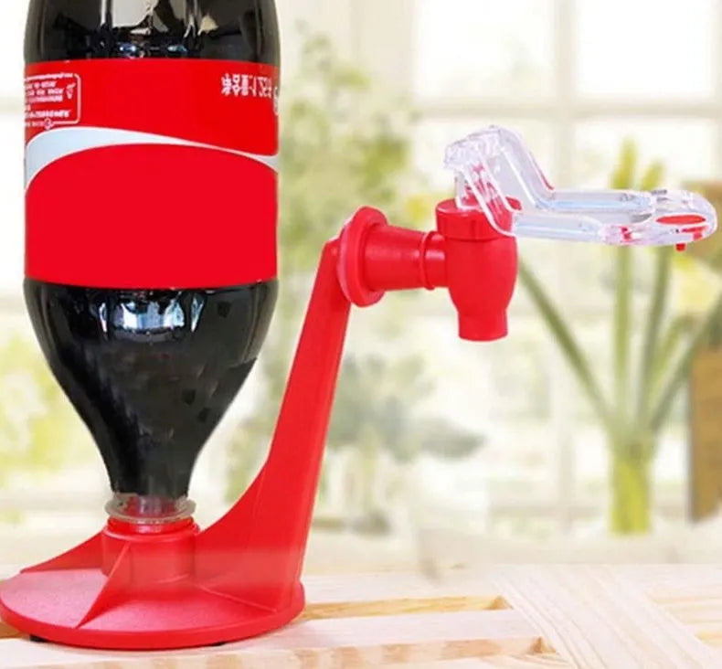 Red plastic Magic Tap soda drink dispenser attached to an inverted 2-litre bottle.