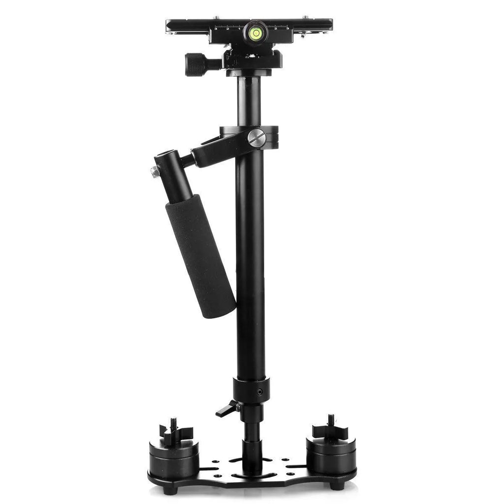 Black aluminium handheld camera stabilizer with adjustable height on a table.