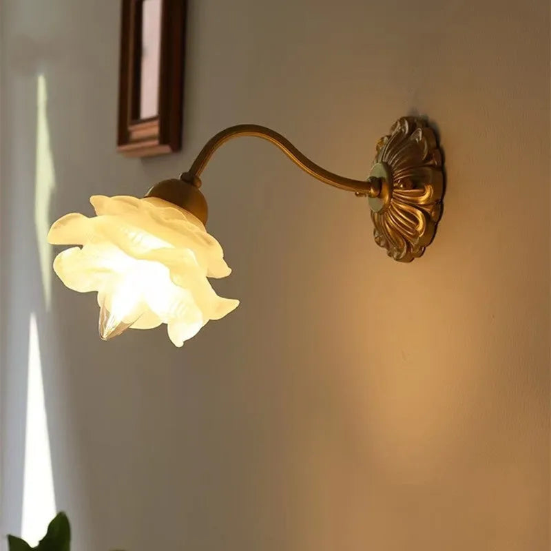 Retro copper wall lamp with frosted glass shade and warm LED light mounted on a bedroom wall