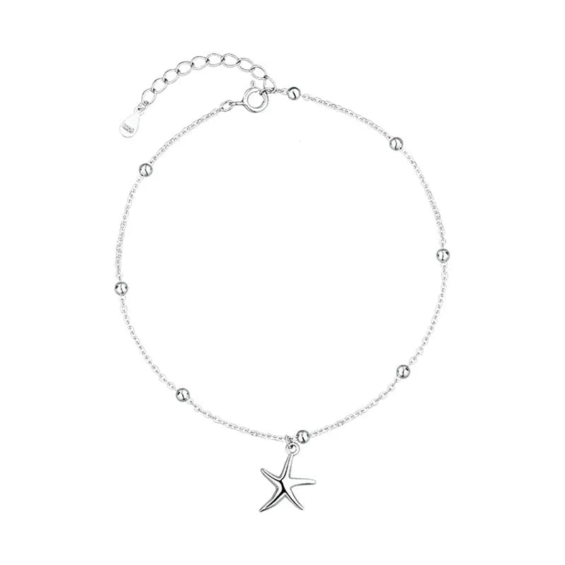 Adjustable sterling silver anklet with a detailed starfish charm and round beads on a silver chain.