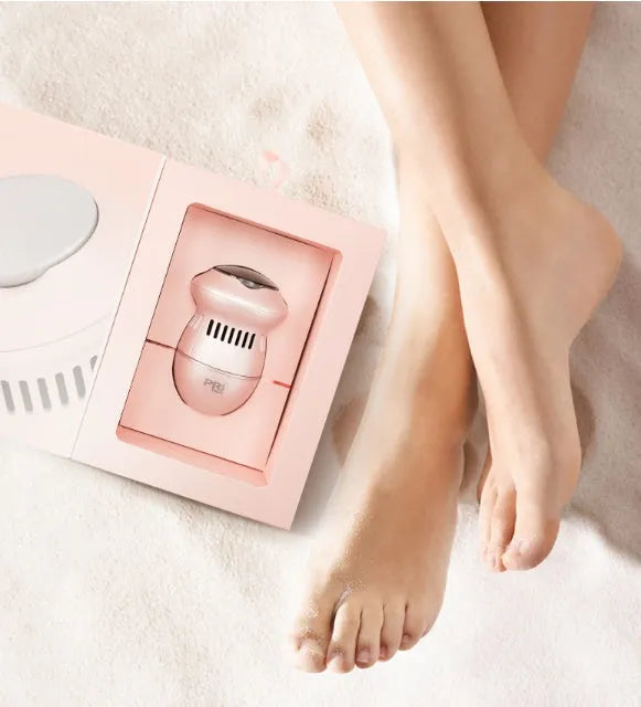 Beige and white electric foot file callus remover with two grinding heads and USB cable
