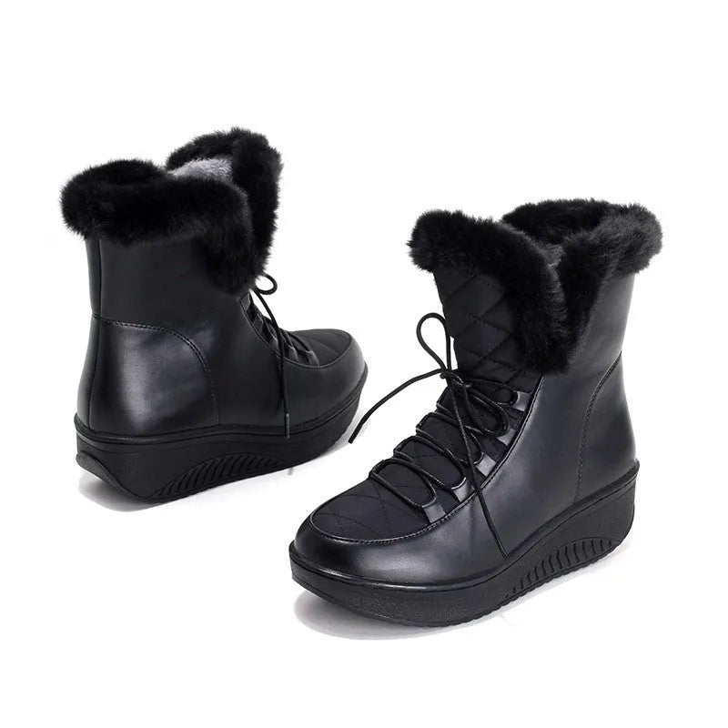 Black lace-up women's winter boots with a platform heel and plush lining on a white background.