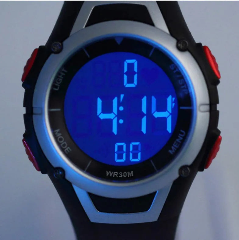 Black heart rate monitor watch with rubber strap and round dial, waterproof to 3 metres with chest strap