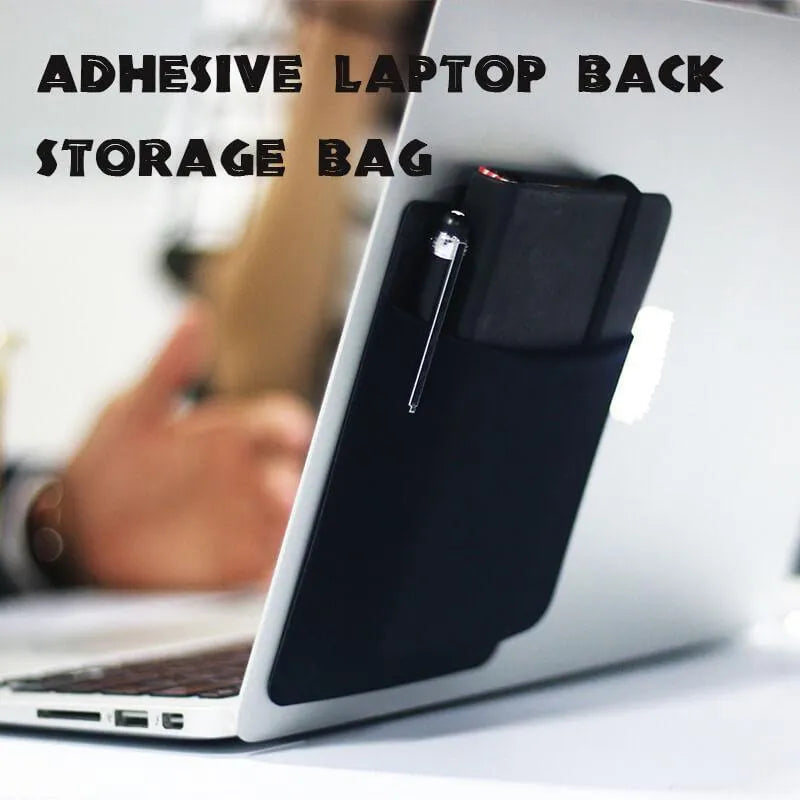 Black adhesive Lycra laptop back storage bag 15x12cm with pen loop, attached to laptop showing items inside
