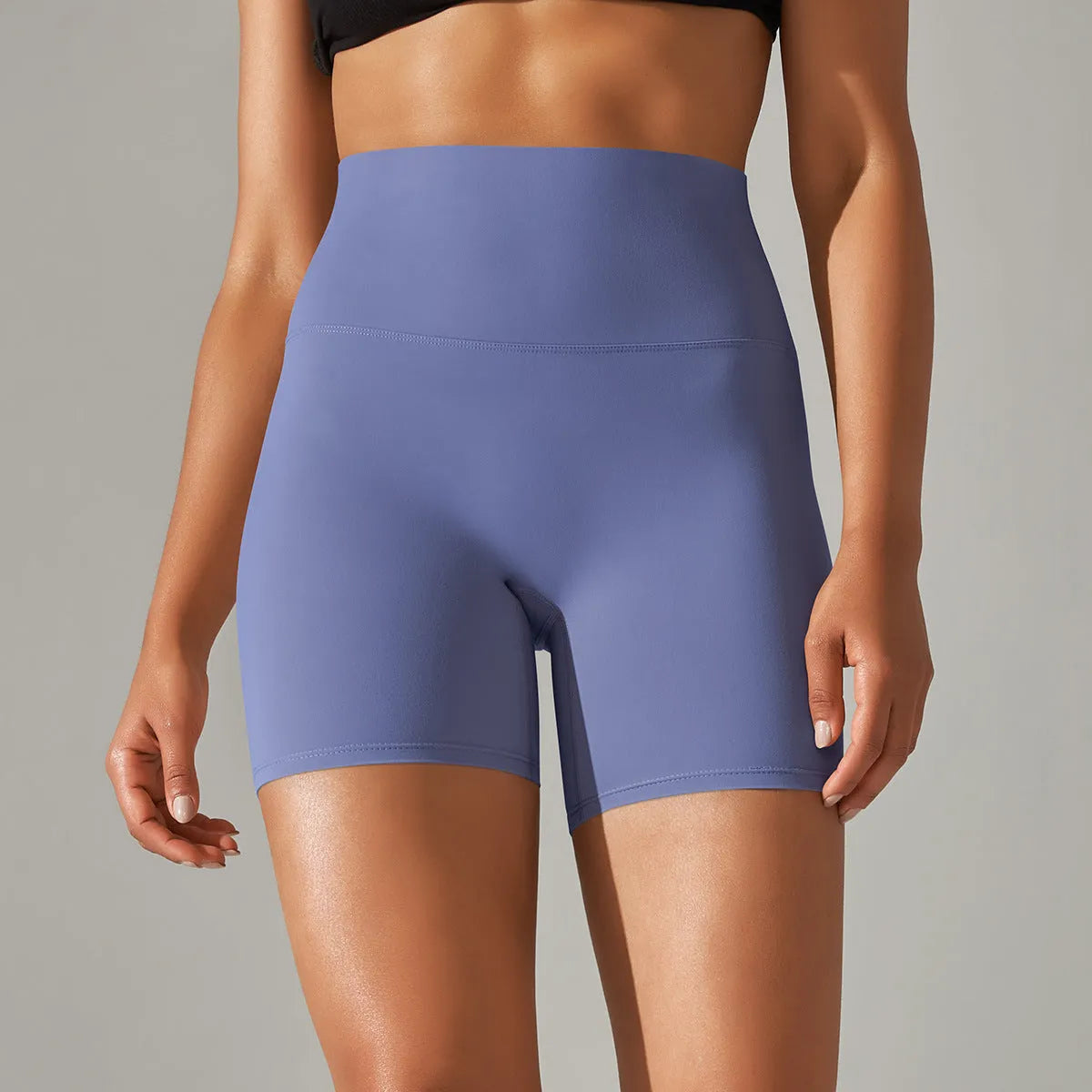 Women's high waist fitness tights in dark green, showing belly control and hip lift design for sports.