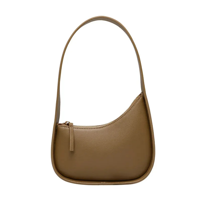 Genuine leather half moon shaped women's shoulder bag with wide strap in caramel colour