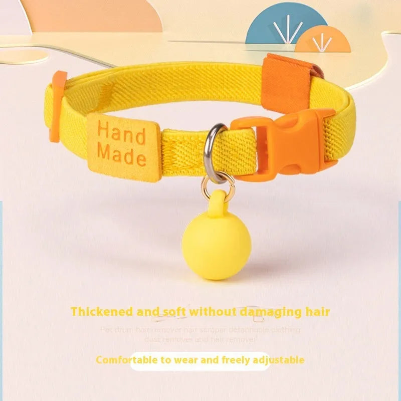 A small, high-elasticity polyester dog collar in a monochrome colour, showing the plastic buckle and adjustable strap.