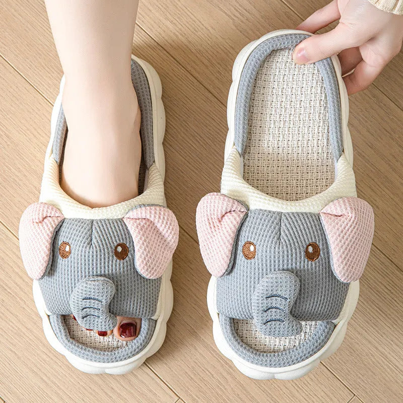 Elephant grey animal print open-toe linen slippers for couples on a PVC sole.