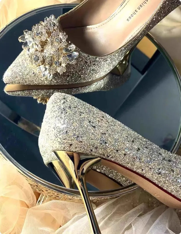 Champagne coloured women's wedding shoes with pointed toe, rhinestone details, and a fine heel.