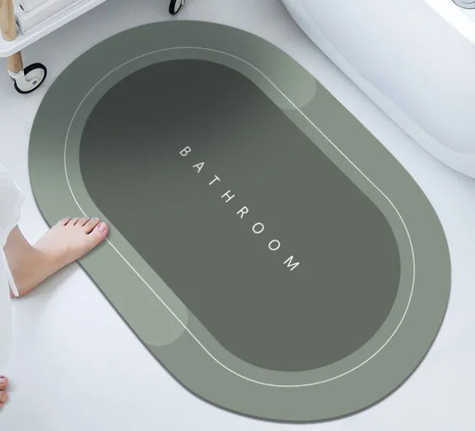 Diatom mud absorbent bathroom floor mat in blue rectangular shape on tiled floor