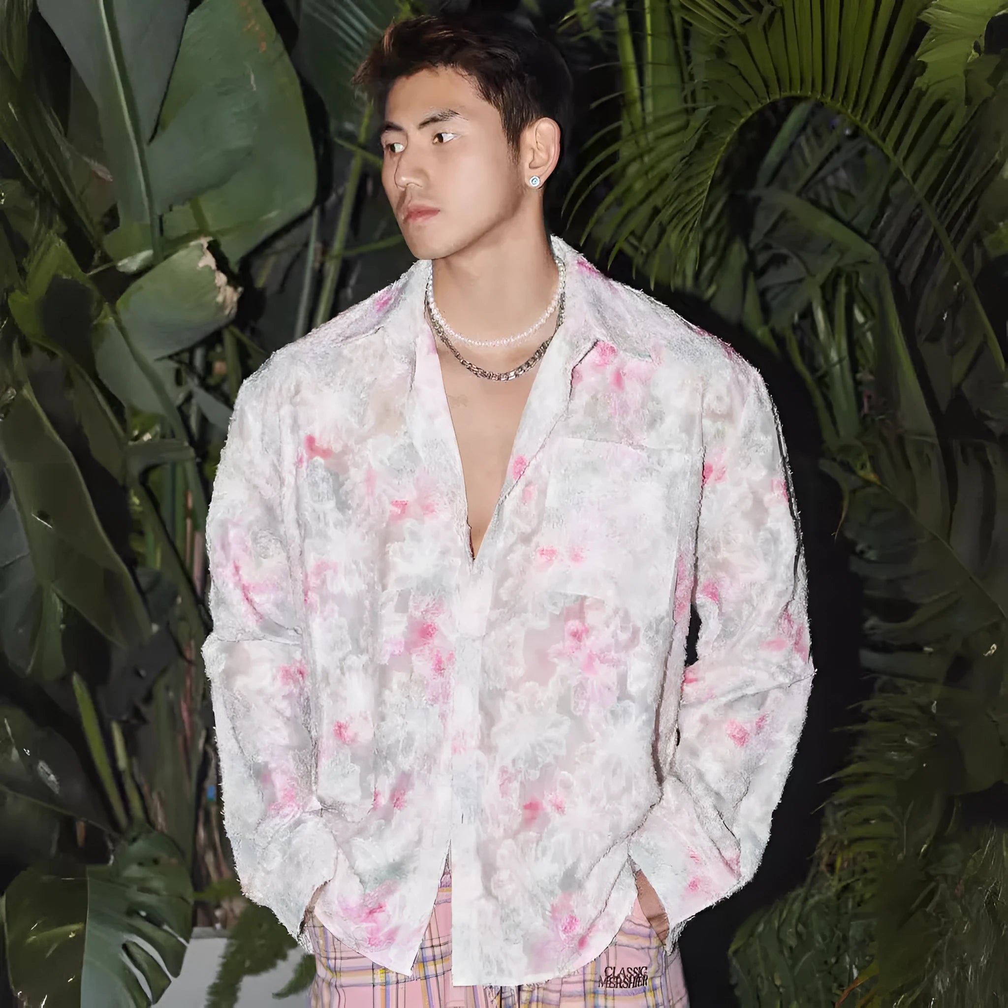 Women's pink floral long sleeve shirt with embossed pattern, shown in a loose fit.