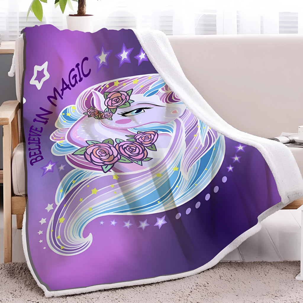 Purple unicorn themed sherpa fleece blanket with hemmed edges, available in 130x150cm and 150x200cm.