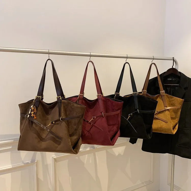 Large capacity soft PU leather shoulder bag for women in retro style with sewing thread detail and pendant