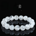 Women's crystal bracelet with round snowflake beads and a traditional Ruyi charm.