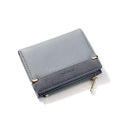 Compact black PU leather ladies wallet open to show card slots, bill compartment, change slot, and zippered section.