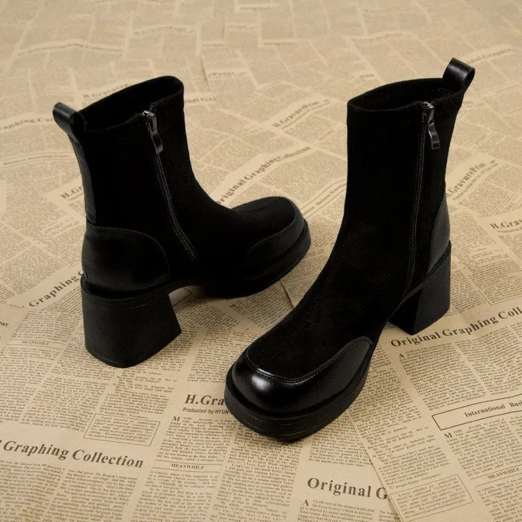 Women's black Martin boots with chunky heel and thick rubber sole, side view