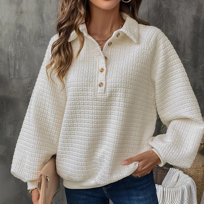 Women's solid colour polo collar sweater with long sleeves in a textured knit.