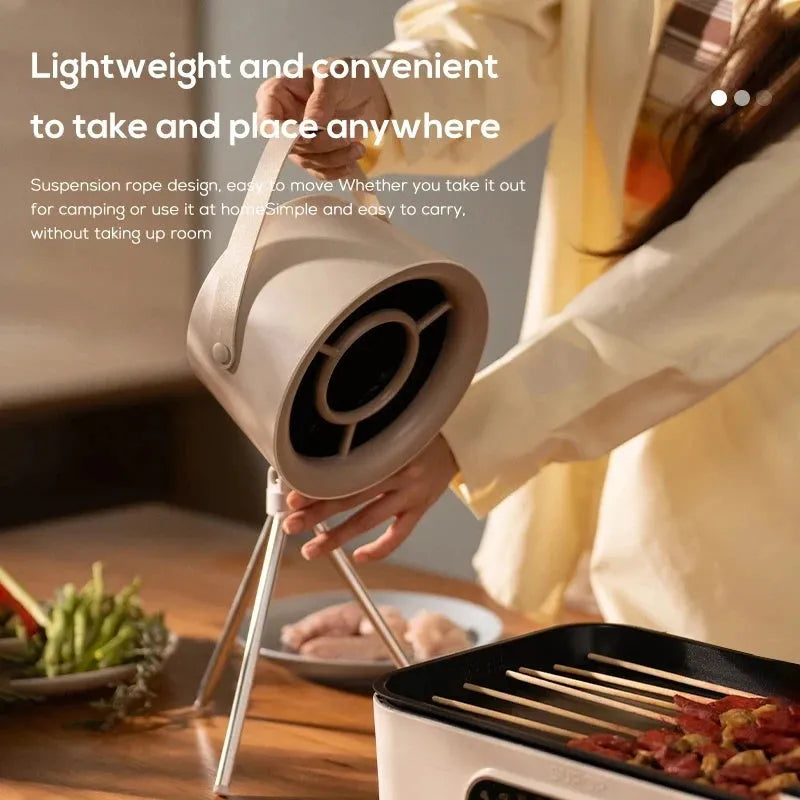 Milky white portable USB desktop exhaust fan with tripod stand and removable filter screen.