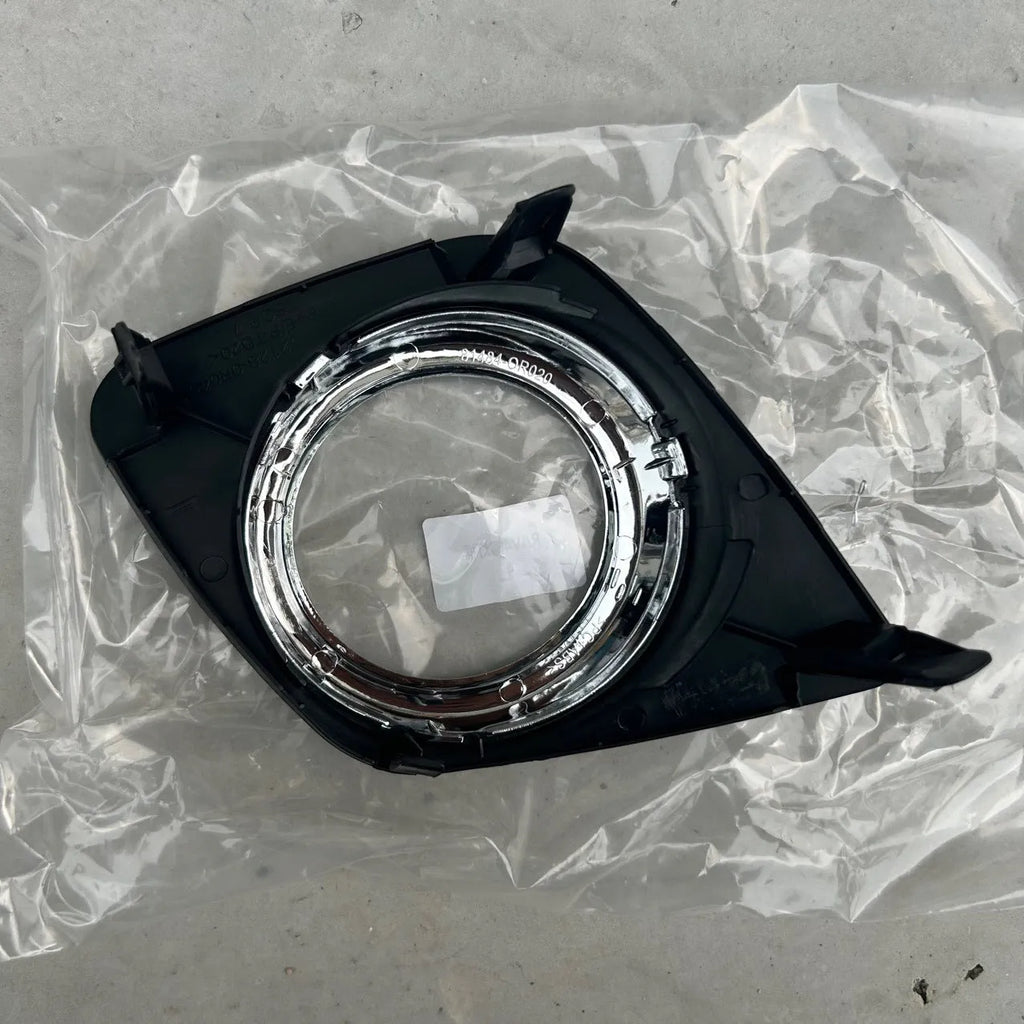 Black anti-fog light cover trim piece for Toyota RAV4 front bumper.