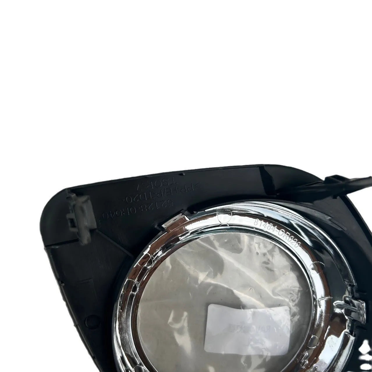 Black anti-fog light cover trim piece for Toyota RAV4 front bumper.