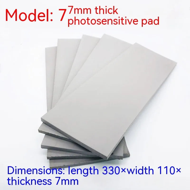 Black and grey plastic light-sensitive mat for seal carving in three thicknesses.