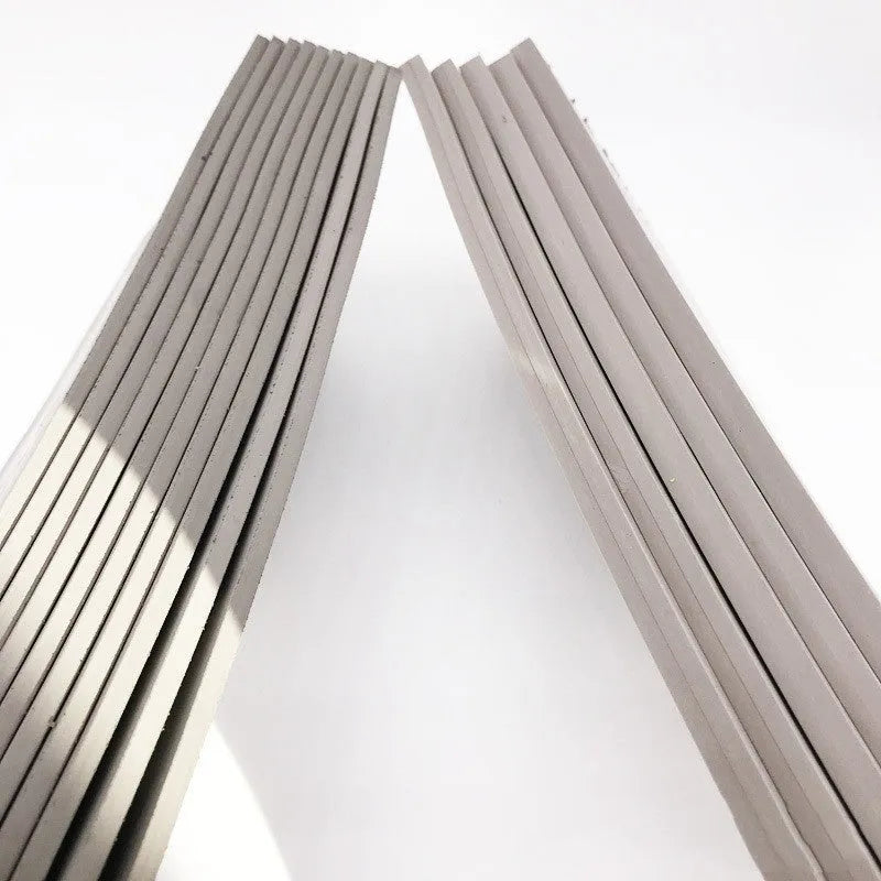 Black and grey plastic light-sensitive mat for seal carving in three thicknesses.