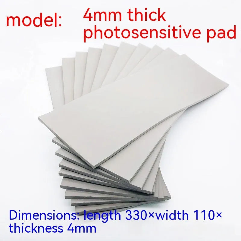 Black and grey plastic light-sensitive mat for seal carving in three thicknesses.