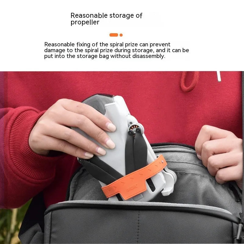 Paddle binding device in gray silicone and ABS holding a propeller blade, compact 8.9cm size