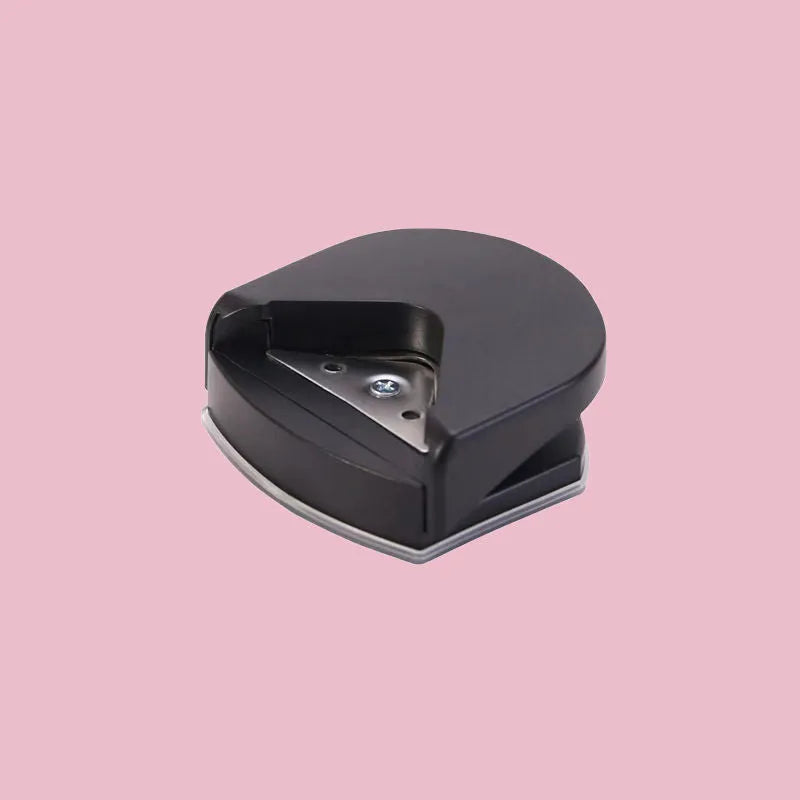 Black plastic and metal business card corner cutter for rounding photo edges.