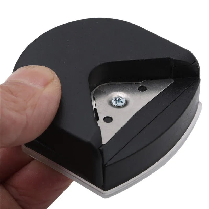 Black plastic and metal business card corner cutter for rounding photo edges.