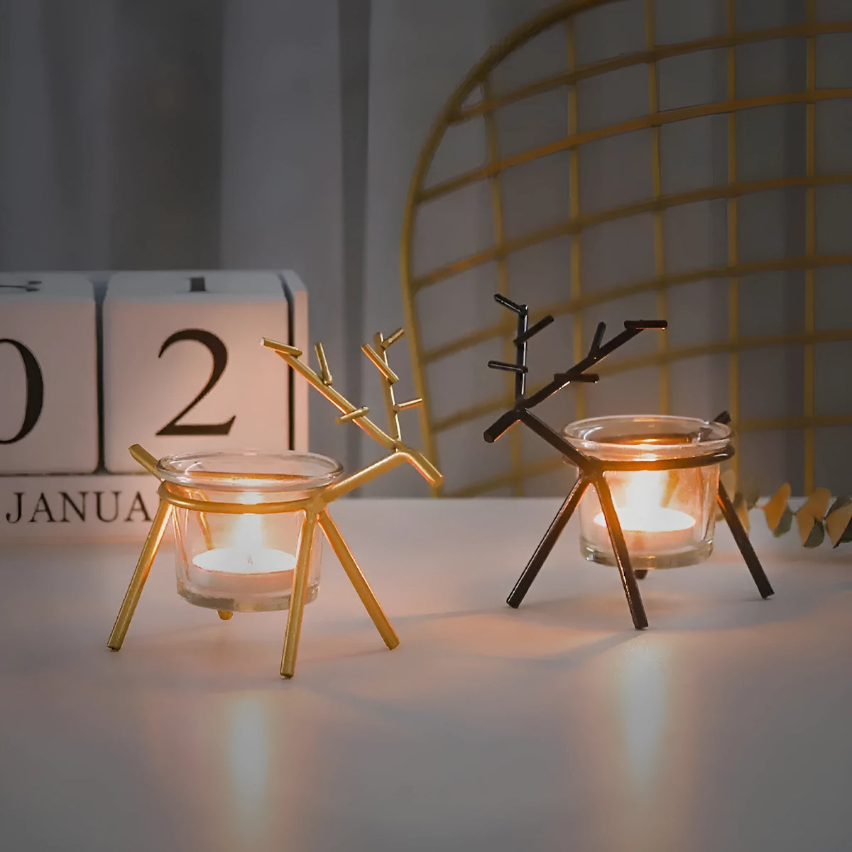 Wrought iron fawn candle holder with glass candle cup, electroplated finish in black or gold
