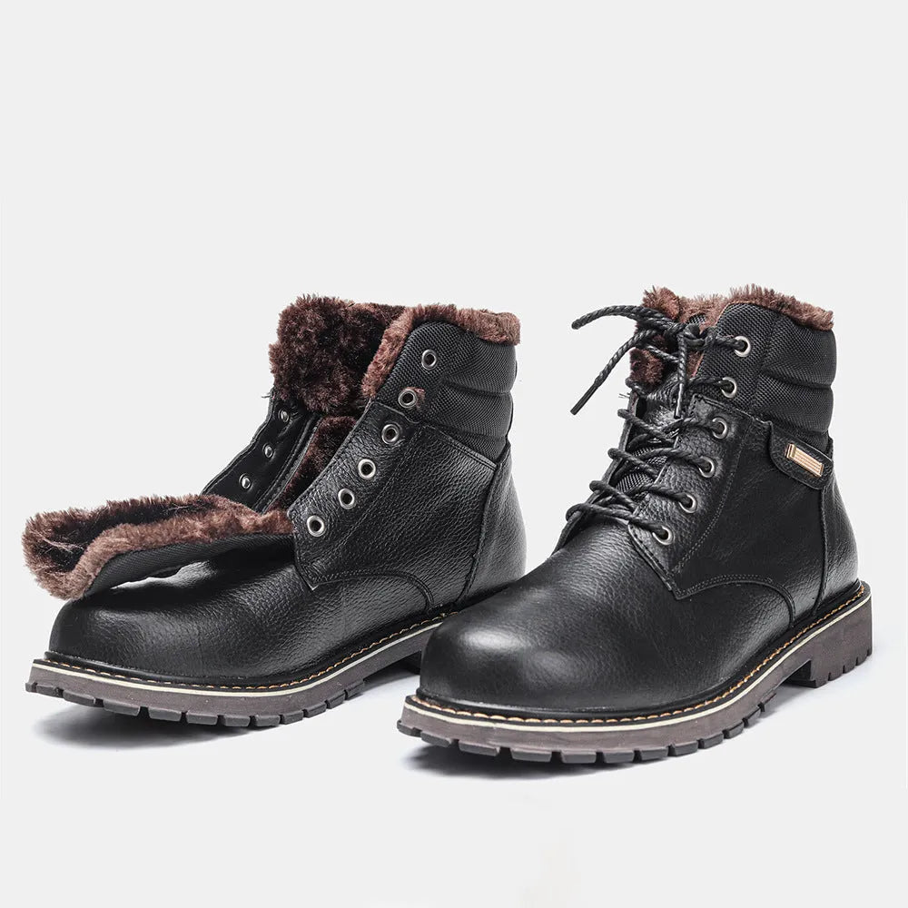 Pair of black plus size men's cowhide leather snow boots with fleece lining, mid-calf height and rubber sole.