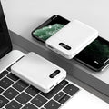 Black and white plastic power bank with dual USB ports showing 92x63x23mm dimensions